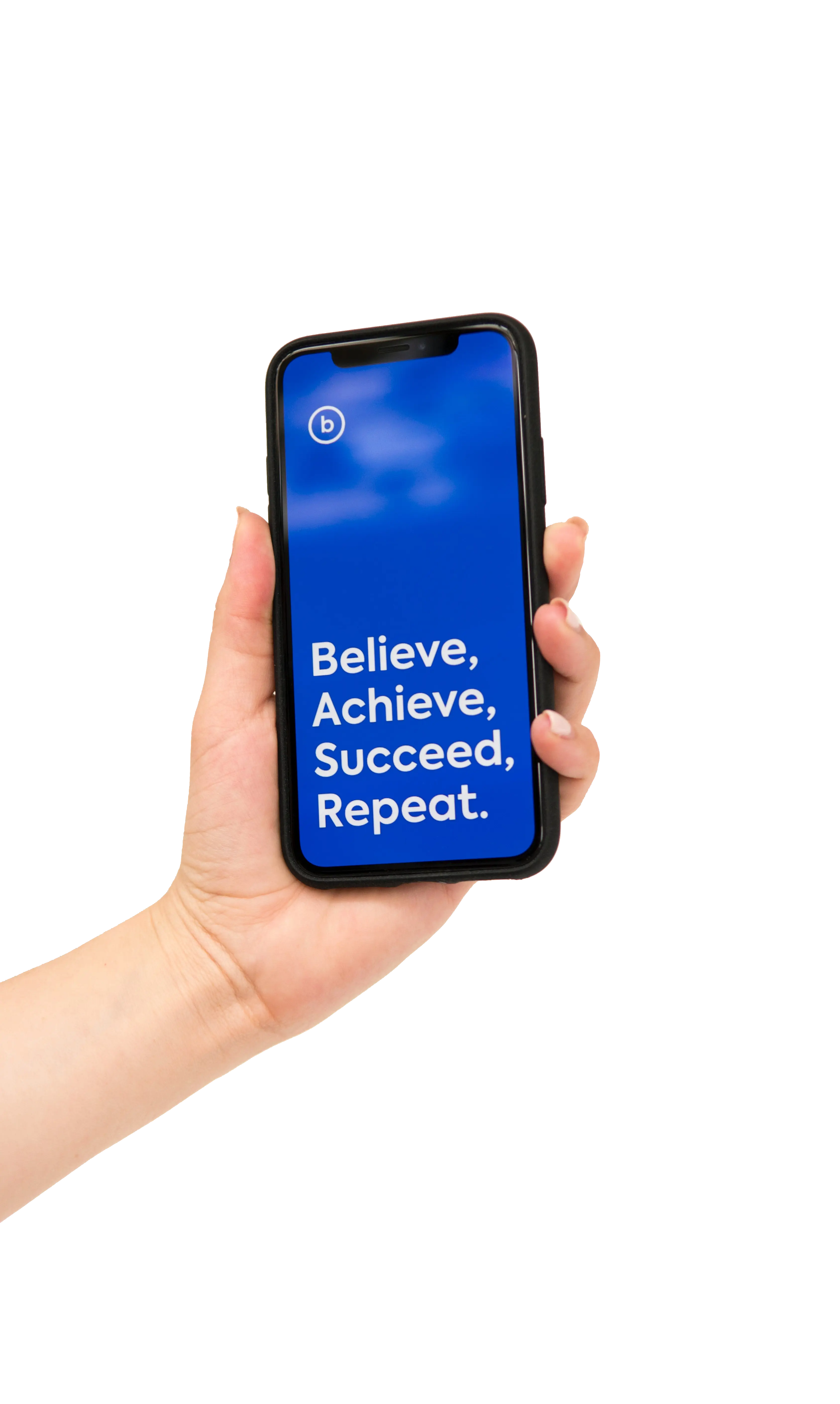 A well-manicured hand holds a black cell phone with a blue background. The screen reads in white text, 'Believe, achieve, succeed, repeat'.